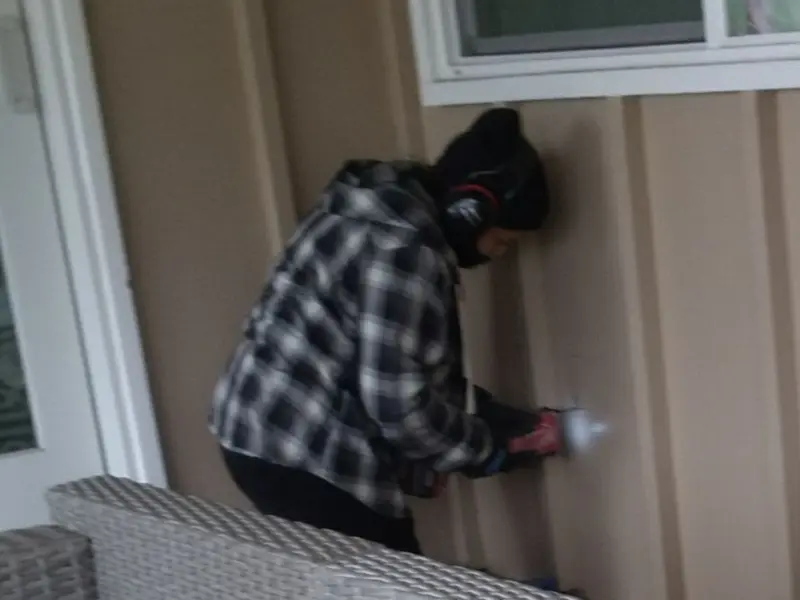 Professional electrician installing an exterior outlet in Vienna